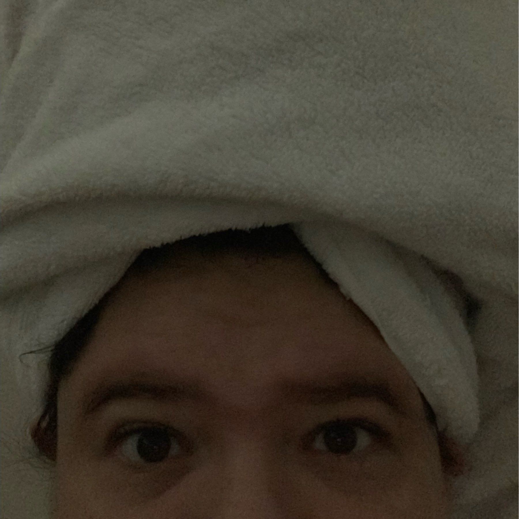 me, from the nose up, with a white towel on my head.